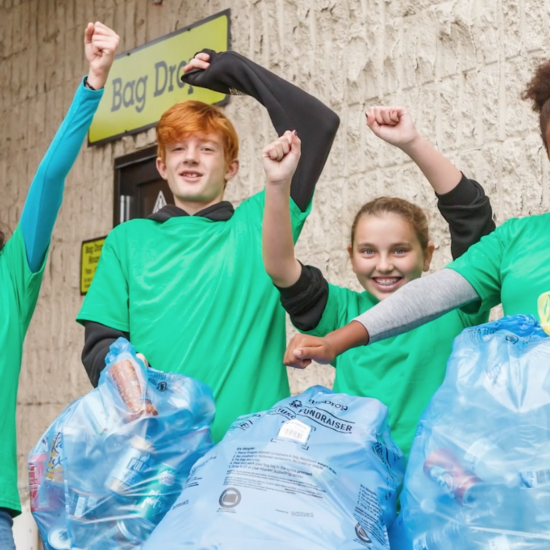 Happy kids returning cans and bottles.