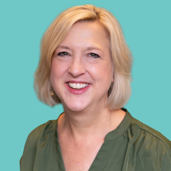 A smiling woman with shortish blond hair.