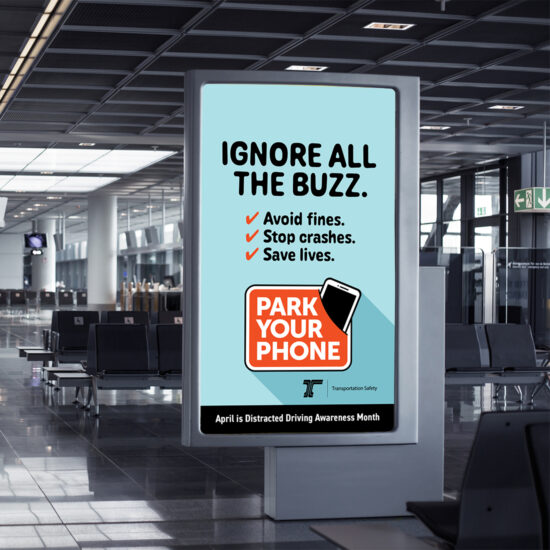 An airport kiosk display of an ODOT "Ignore All the Buzz" public service announcement.