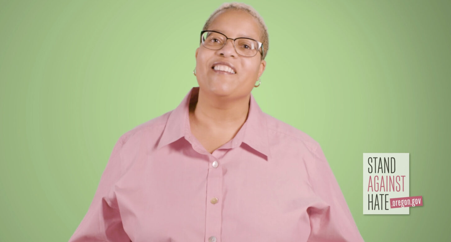 A still from the "Stand Against Hate" video, depicting Fay Stetz-Waters, Director of Civil Rights and Social Justice at the Oregon DOJ, making a statement in support of the Bias Crimes law.