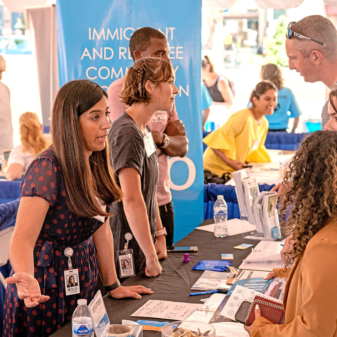 Representatives of the Immigrant & Refugee Community Organization (IRCO) talk with volunteers at The Standard's annual Volunteer Expo in Portland, Oregon.