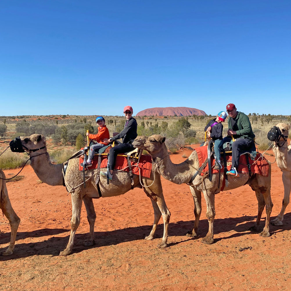 Liz Fuller and family enjoy a camel ride in the Australian Outback near Uluru.