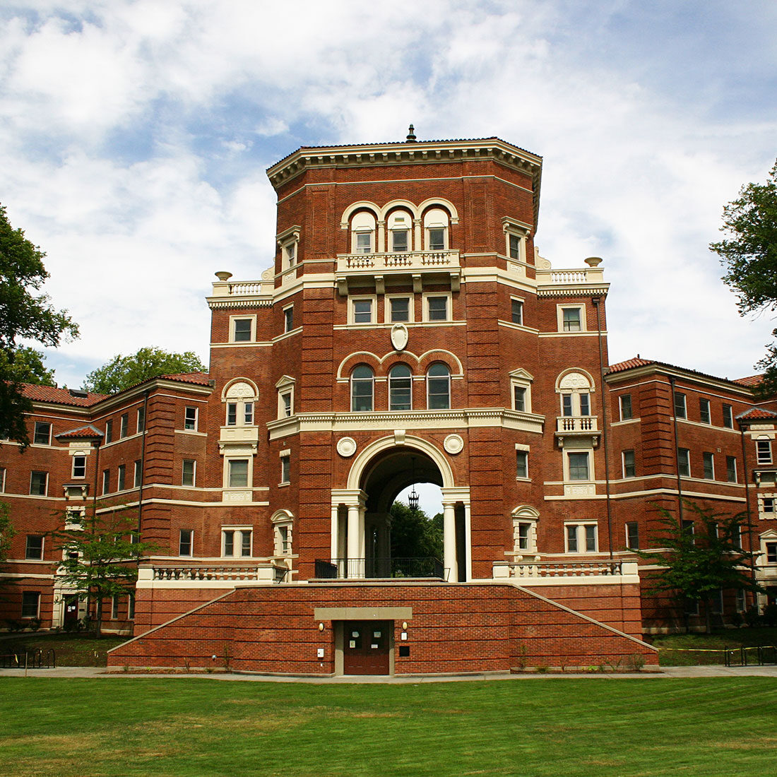 An ornate, multi-story brick building with many arches on the Oregon State University campus.