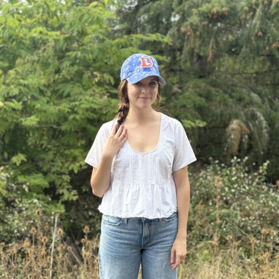 Kate Gillem in a Denver Broncos hat.