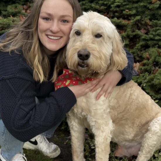 Erica Schroeder hugs her dog.